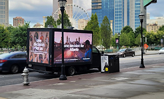 A mobile display truck is used to drive around a specific area